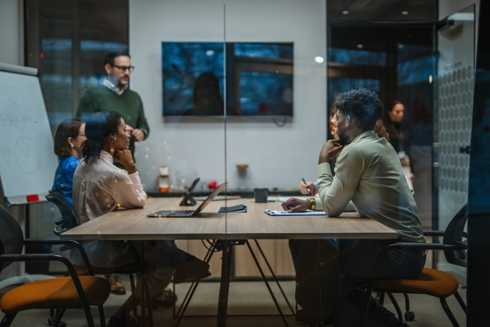 Diverse,Business,Team,In,A,Modern,Boardroom,Listening,To,A